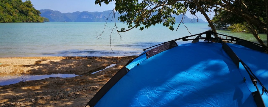 Tropical eco camping: tent near water
